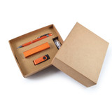A cardboard gift box in brown featuring an orange pen, USB drive, and power bank inside.