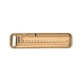 A stationery set featuring a ruler, pencil, sharpener, and eraser, all housed in a sleek, neutral-colored case. A stationery set featuring a ruler, pencil, sharpener, and eraser, all housed in a sleek, neutral-colored case.