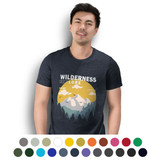 A man wearing a navy T-shirt featuring a mountain and sunset graphic. The shirt has a logo and comes in multiple colours.