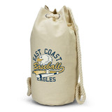 A cream-coloured canvas barrel bag with a rope handle and a logo featuring an eagle and text.