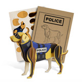 A wooden model of a police dog in brown and black, accompanied by assembly sheets and packaging.