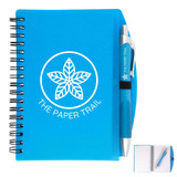 A blue spiral notebook with a pen attached, featuring a logo on the cover.