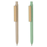 A bamboo fibre pen in beige and a green variant, featuring a sleek metal clip and a simple design.