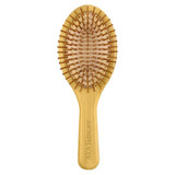 A bamboo hairbrush with a wooden handle and bristle pins, featuring a smooth oval design in natural tones.