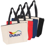 A set of four Calico Zip Shopper tote bags in cream, red, navy, and black, featuring a logo on the front.