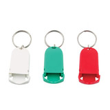 A pill box keychain set in white, green, and red, featuring a flip-top design and attached key ring.