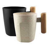 A reusable coffee cup in black and a speckled light cream, featuring a wooden handle. Includes branding.