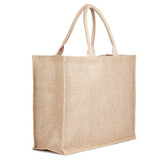 A natural jute bag in a light beige colour, featuring double handles and a simple, unadorned design.