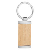 A wooden panel key ring with silver metal accents and a circular attachment.
