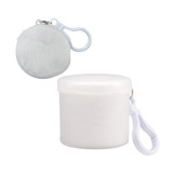 A white Cloud Poncho packaged in a round container, featuring a clip for easy attachment.