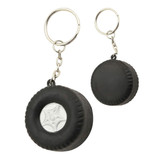 A black tyre-shaped key ring with a silver centre, featuring a metal chain and keyring attachment.