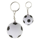 A stress soccer ball key ring in white and black with a shiny metal chain and ring.