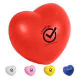 A red heart-shaped stress ball with a logo, accompanied by white, pink, yellow, and blue heart shapes.