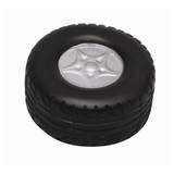 A black stress relief toy shaped like a tyre, featuring a silver rim in the centre. It has a textured surface.