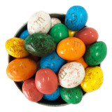 A bowl filled with various candy coated chocolate eggs in vibrant colours, including blue, green, red, and yellow. A bowl filled with various candy coated chocolate eggs in vibrant colours, including blue, green, red, and yellow.