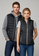 A black puffer vest with a zip, featuring two models wearing it over casual clothing, one style for men and one for women.