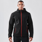 A black softshell hoody with red accents, featuring a zip front, zip pockets, and a hood. Includes branding.