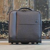 A wheeled underseat luggage in dark grey fabric with a carry handle and a logo.