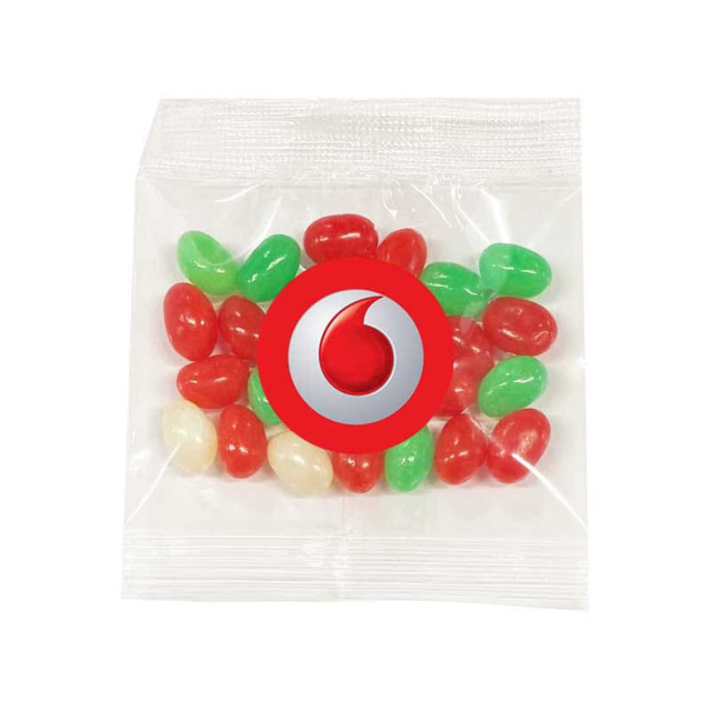 A clear bag containing red, green, and white jelly beans, featuring a logo on the front. A clear bag containing red, green, and white jelly beans, featuring a logo on the front.