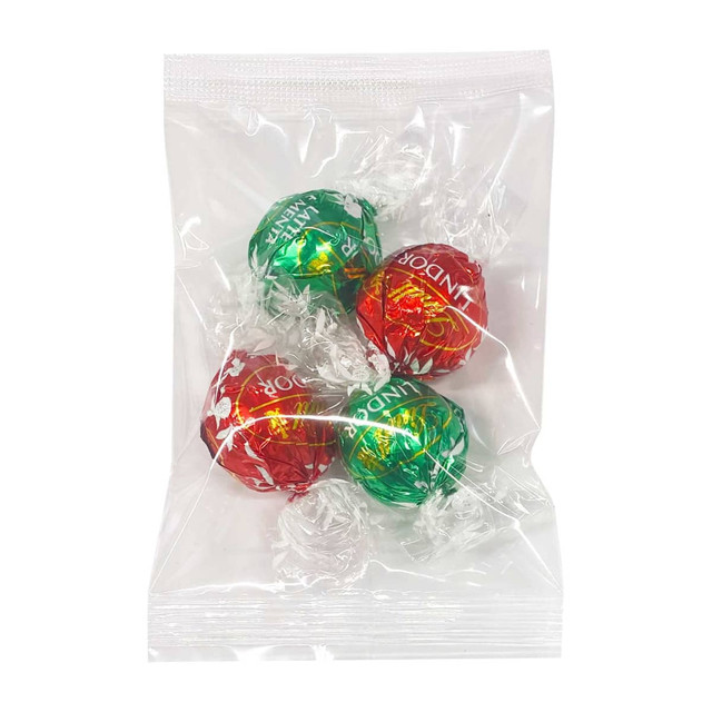 Four wrapped chocolate balls in red and green packaging, displayed in a clear, sealed bag with decorative paper. Four wrapped chocolate balls in red and green packaging, displayed in a clear, sealed bag with decorative paper.