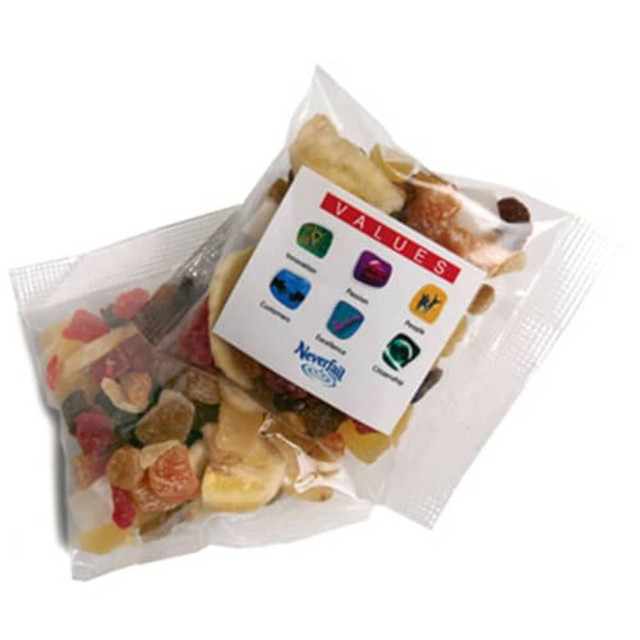 A transparent bag containing a mix of colourful dried fruits including banana, pineapple, and assorted berries.