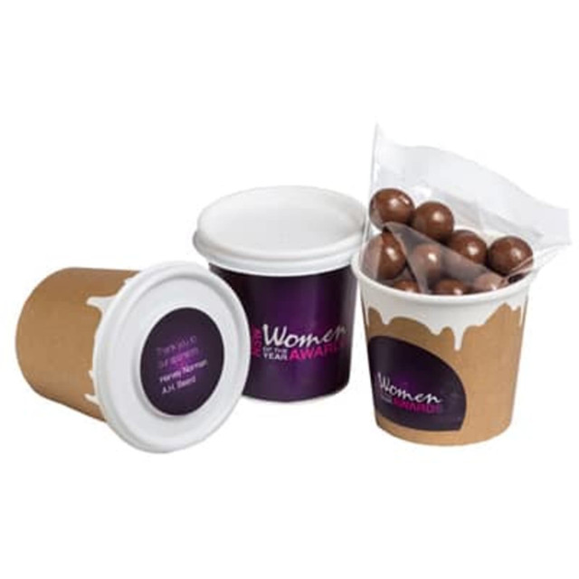 Coffee cup featuring chocolate-coated coffee beans, in brown and white, with a lid and a sticker on one side.