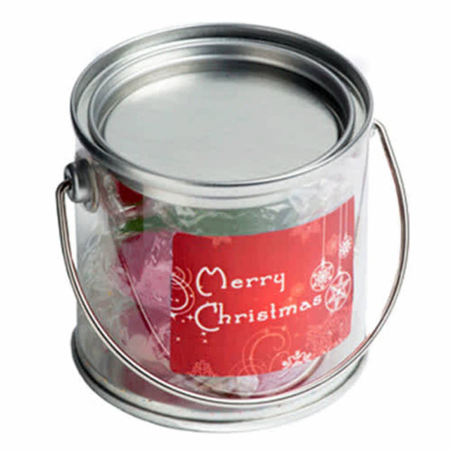 A small silver PVC bucket filled with Christmas twist-wrapped boiled lollies, featuring a festive label.