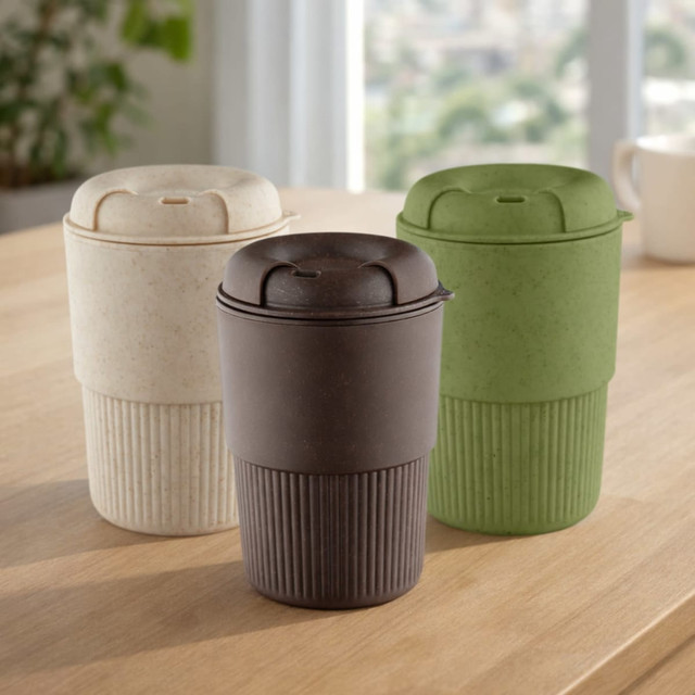 A drink bottle in three colours: cream, dark brown, and green, with a ribbed design and a lid, featuring a logo.