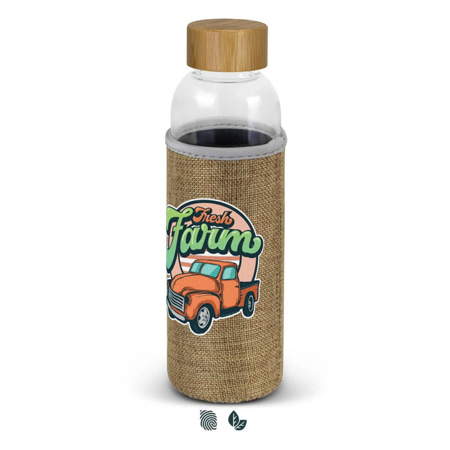 A drink bottle with a clear glass body and a natural beige sleeve featuring a graphic design and a wooden lid.