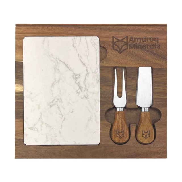 A marble cheeseboard with wooden handled knives on a walnut wood tray. Features a logo on the tray.
