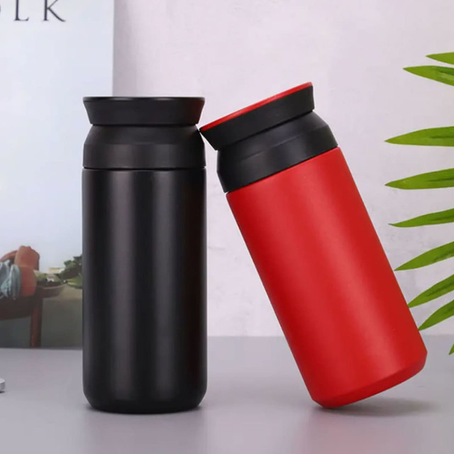 A drink bottle set featuring a black and a red bottle, both with sleek designs and black lids.