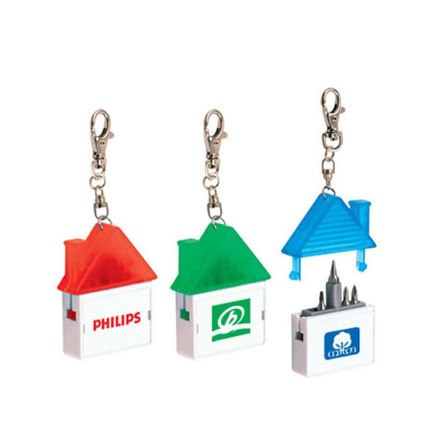 A house-shaped tool set in red, green, and blue with keychain clips, featuring a logo on each item.