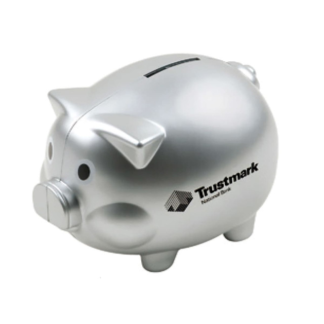 A silver pig-shaped coin bank with a slot for coins and a logo on the side.