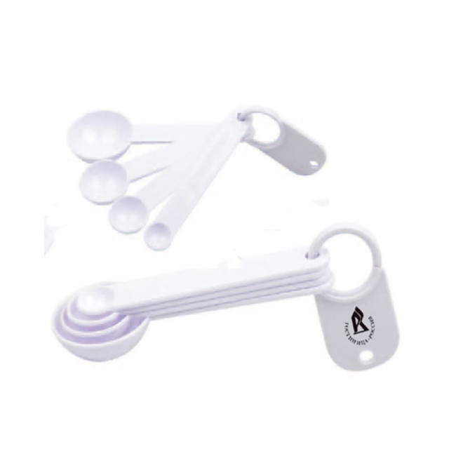 A set of white measuring scoops in various sizes, joined by a ring, with a logo on one scoop.