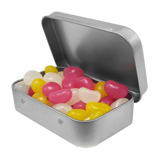 A silver tin containing a variety of jelly beans in pink, yellow, and white colours.