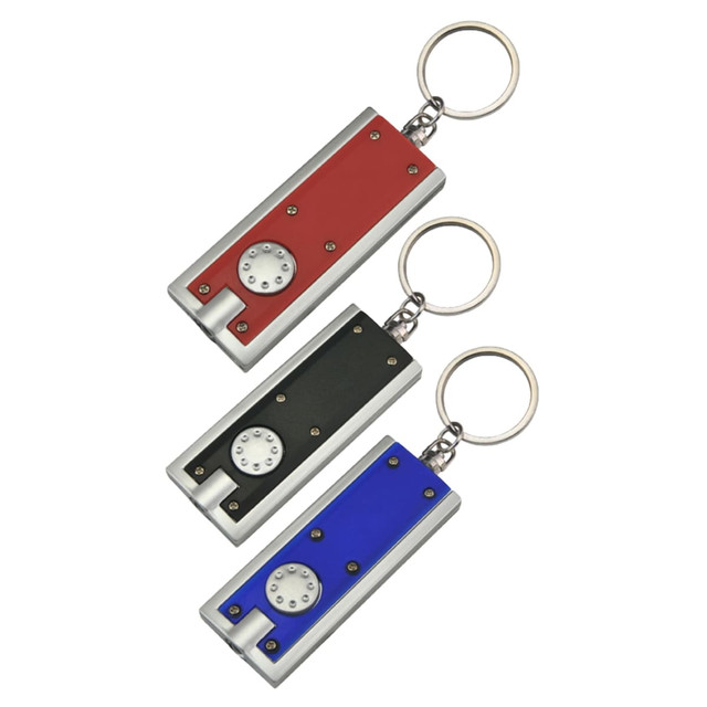 A set of three keyrings featuring a metallic design in red, black, and blue colours with circular details.