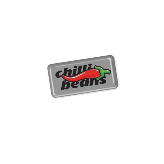 A rectangular resin-coated label featuring a red chilli and the text "chilli beans" in black on a silver background. A rectangular resin-coated label featuring a red chilli and the text "chilli beans" in black on a silver background.