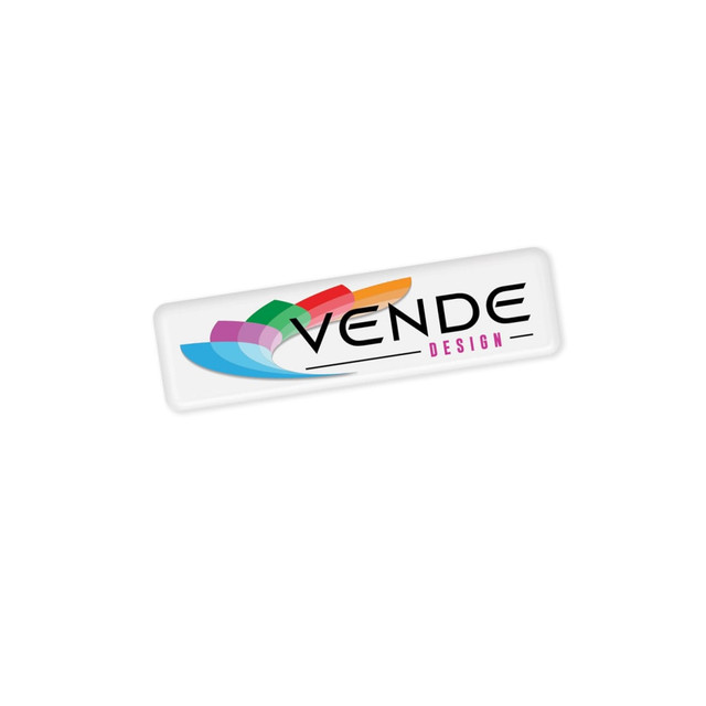 A white sticker with a colourful logo and the text "VENDE DESIGN" in bold lettering. A white sticker with a colourful logo and the text "VENDE DESIGN" in bold lettering.