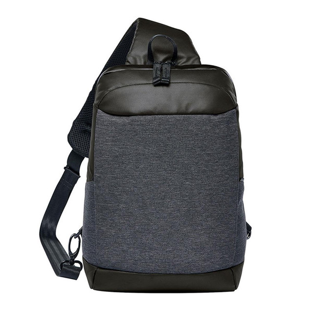 A slate grey and black sling backpack featuring a single adjustable strap and a logo.