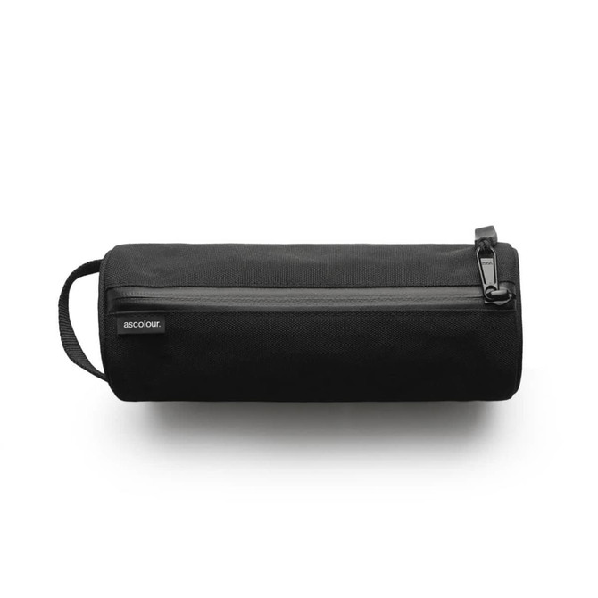 A black recycled stationery bag with a zip closure and side handle, featuring a minimal logo.