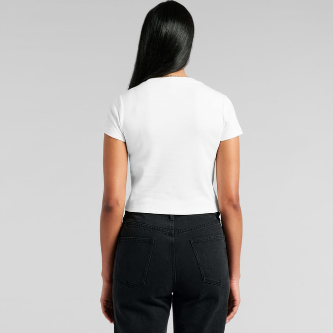 A white T-shirt with short sleeves, viewed from the back, paired with black high-waisted pants.