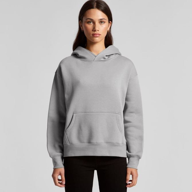 A grey hoodie with a front pocket and a hood, featuring a logo. Model displaying the garment.