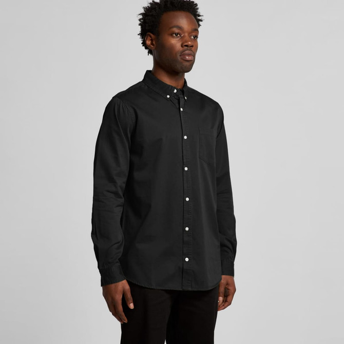A black denim wash shirt with a button-up design, long sleeves, and a single chest pocket.