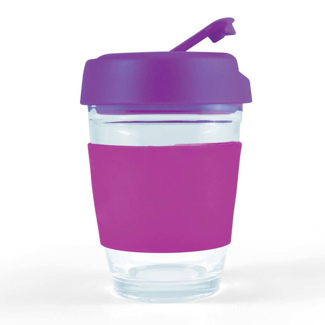 A reusable coffee cup with a clear body, purple flip lid, and a pink silicone sleeve for grip.