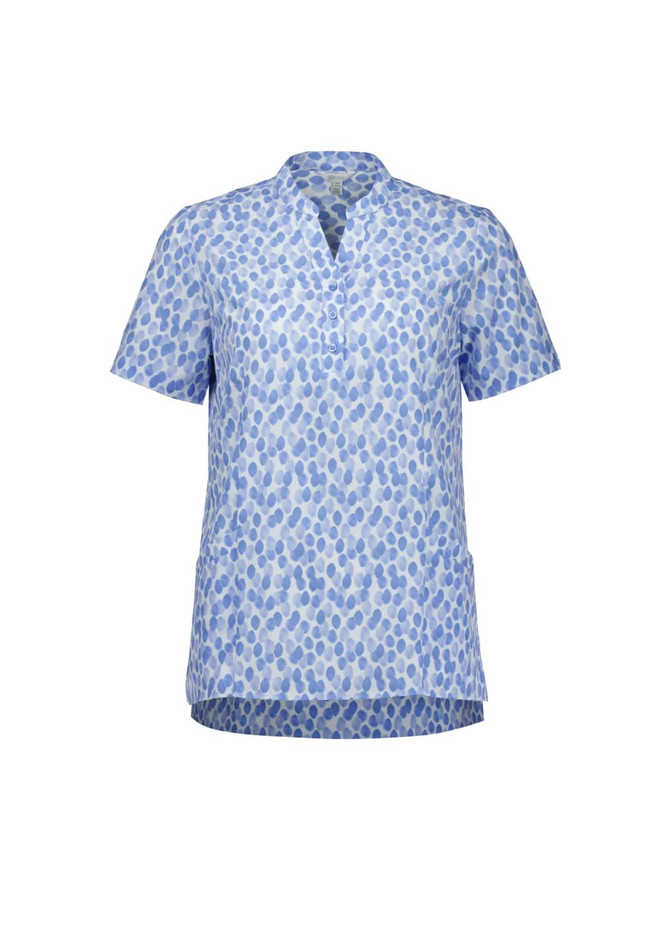 A blue and white tunic featuring a stardust print, with a v-neck and short sleeves. It has a branding logo.