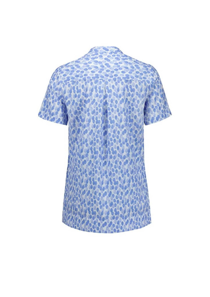 A blue and white tunic featuring a stardust print, with short sleeves and a back pleat. It has a logo.