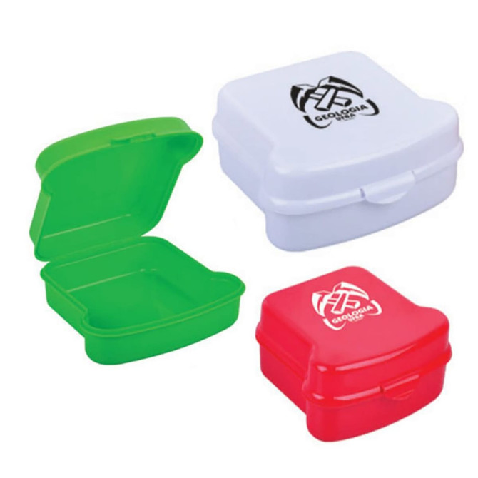 A red, green, and white lunch box set with a lid, featuring a logo on the top of each box.