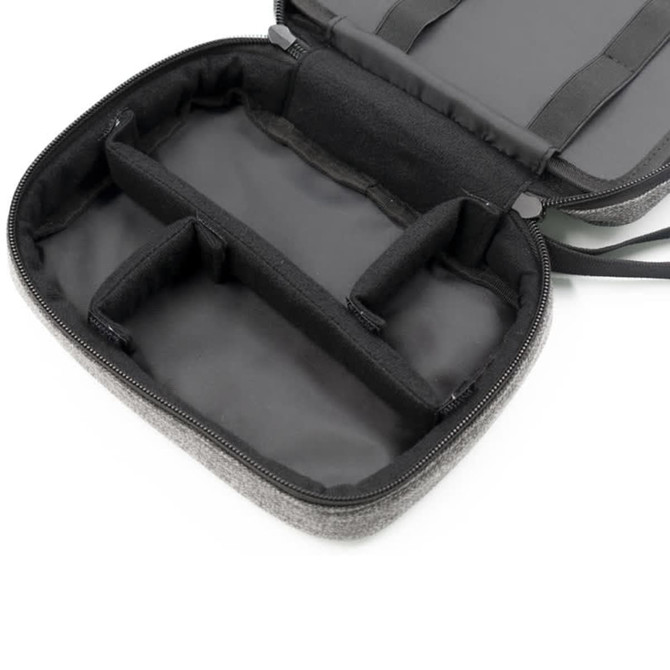 A grey toiletry bag with a zippered closure, featuring multiple inner compartments and a sleek black interior.