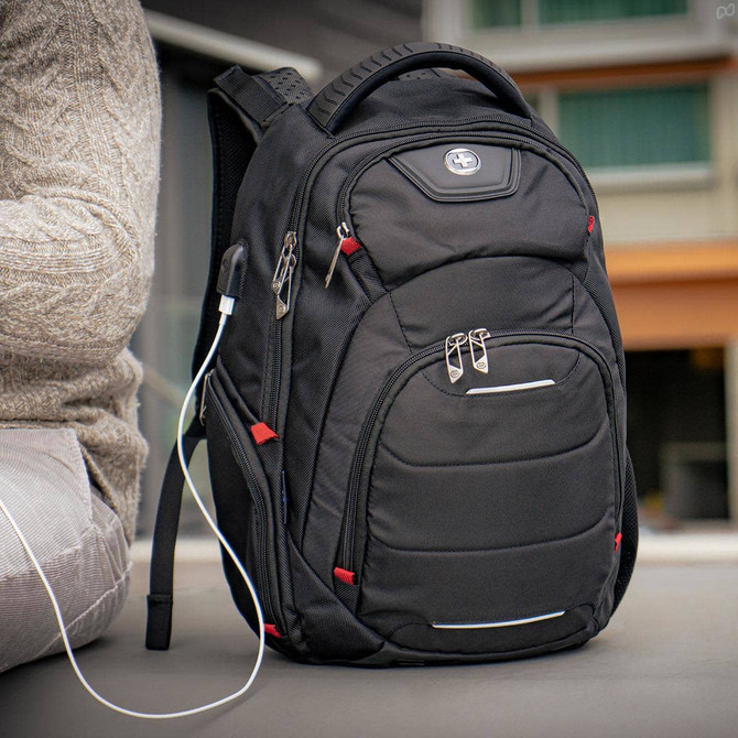 A black Swissdigital Neptune Backpack with multiple pockets, zippers, and a logo. An earphone cable is attached.