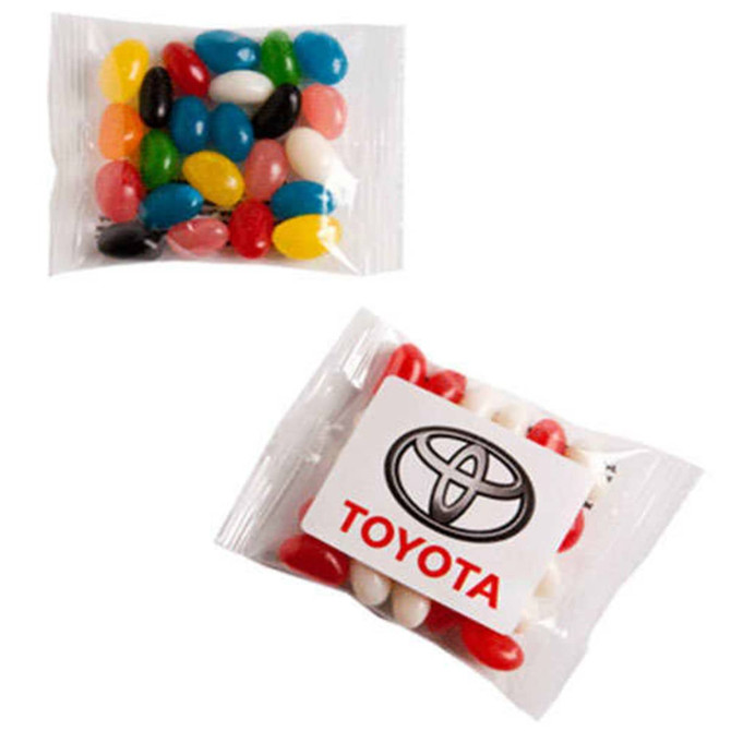 A clear bag of mini jelly beans in various colours, featuring a logo on one side.